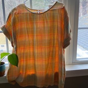 Soft yellow green and yellow plaid cotton/rayon blouse. Button closure at neck.